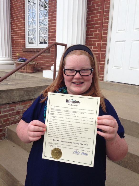 Kamrie outside City Hall just after Mayor Eaton finished proclaiming May 16, 2014 as "JUST1 Day" for the City of Russellville